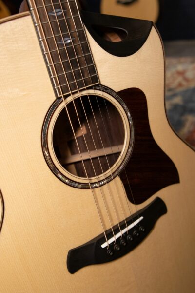 "Explore a diverse selection of pre-owned acoustic guitars, each with its own story and timbre, waiting to find a new home. From vintage classics to modern marvels, these instruments offer a sustainable and cost-effective option for musicians at all levels. Discover the perfect blend of rich tones and history with each strum on these gently used treasures."